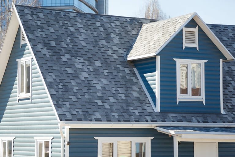 Suburban Colorado Springs home showing roof and siding elevations after a storm