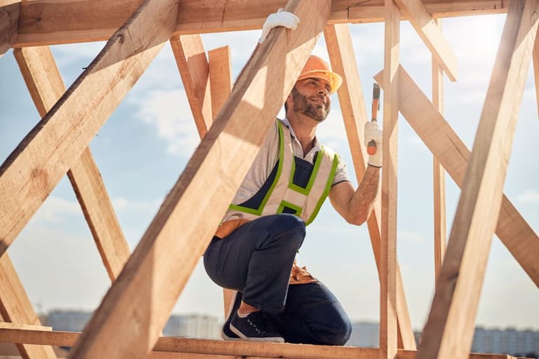 L&N Construction crew member building a roof with skilled craftsmanship