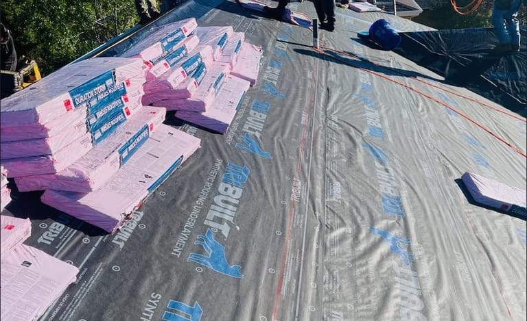 Architectural shingles loaded onto a Colorado Springs roof ahead of installation